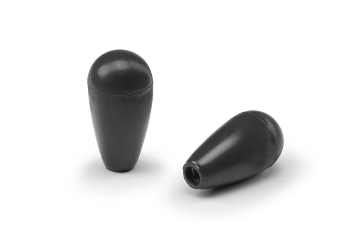 Monplast-Conical-Handle Two black conical handles arranged on a neutral background.