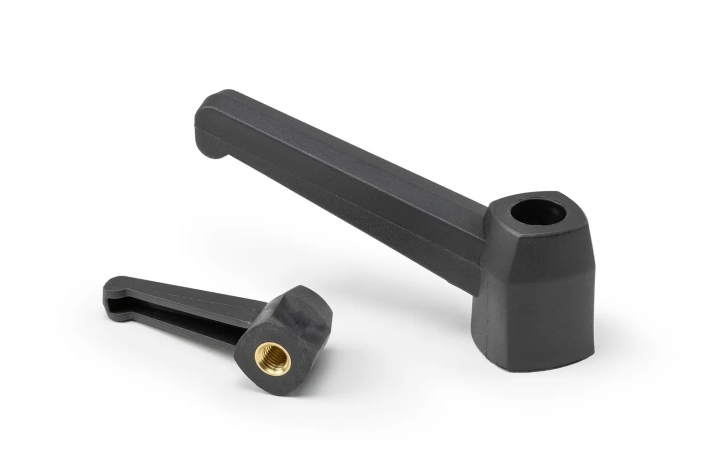 Monplast-Fixed-Levers-Bushing Two black fixed levers with bushing, of different sizes, arranged on a neutral background.