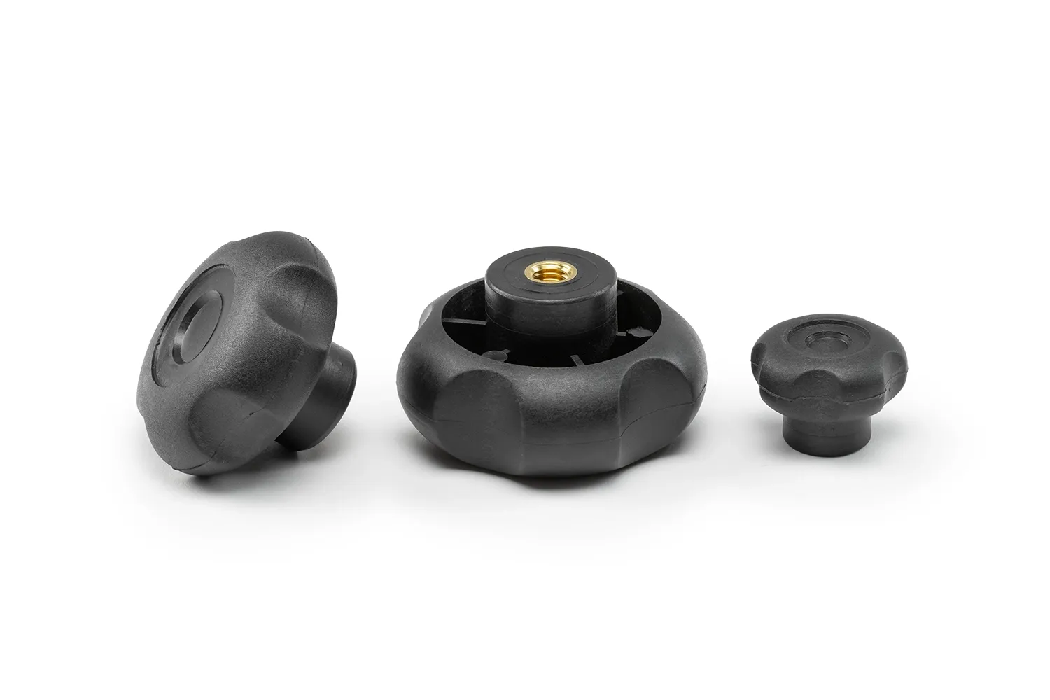 Three black 5-lobe handwheels with bushings, in different sizes, arranged on a neutral background.