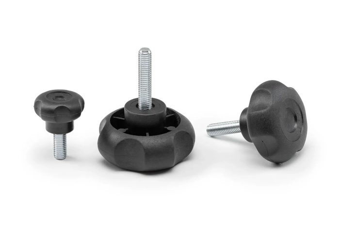 Three black 5-lobe handwheels with screws, of different sizes, arranged on a neutral background.