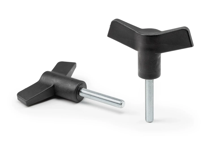 Two black wing knobs with studs arranged on a neutral background.