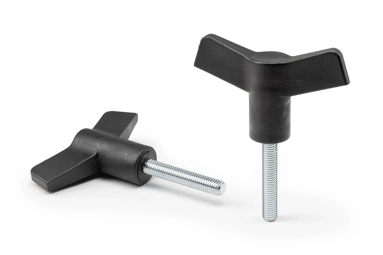 Two black wing knobs with studs arranged on a neutral background.